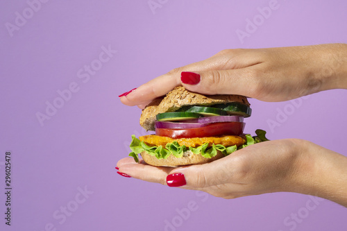 Delicious burger on a beautiful purple background