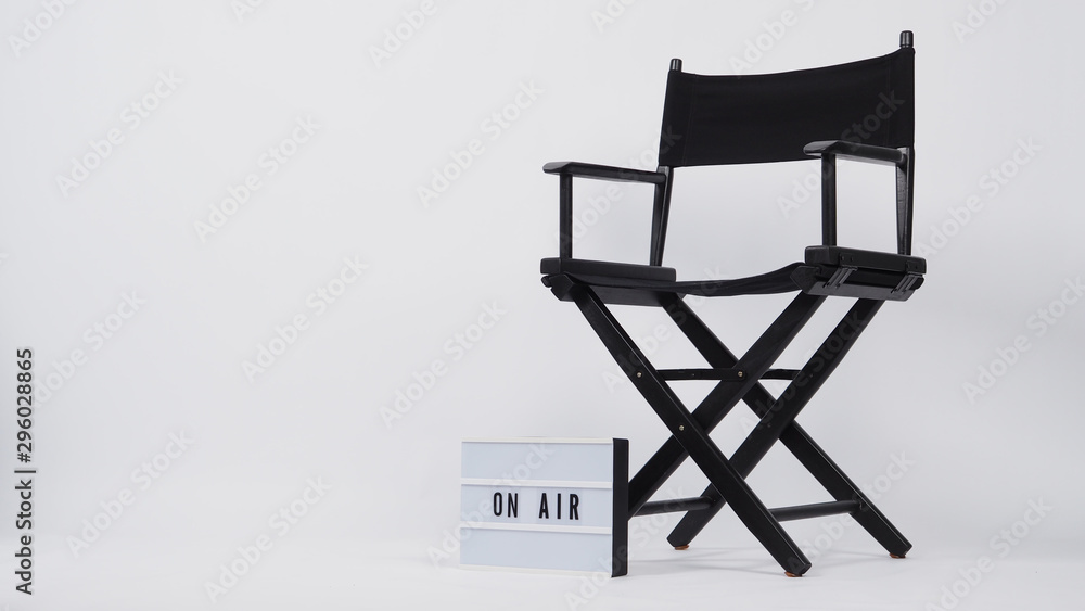 Black director chair and lightbox with word.It is used in video production,film and cinema industry on white background. Black director chair and lightbox with word.It is used in video production,film and cinema industry on white background.