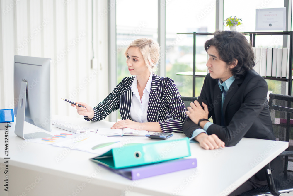Business man and business woman are analytics business data, business plan concept Business man and business woman are analytics business data, business plan concept