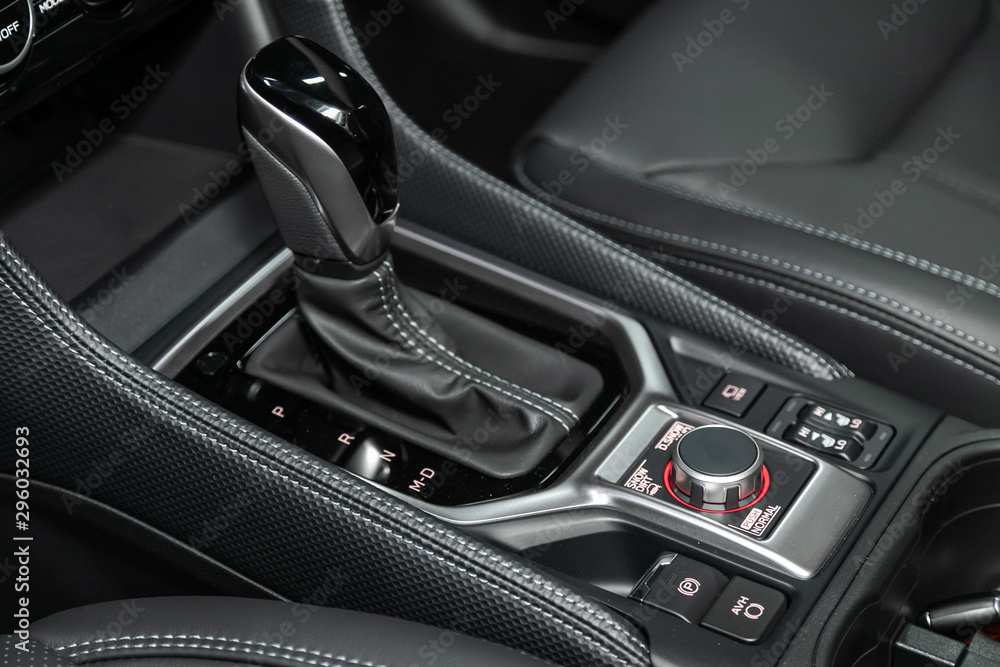 Close-up of the accelerator handle and buttons with  modern central console with  controls. automatic transmission gear of car , car interior.