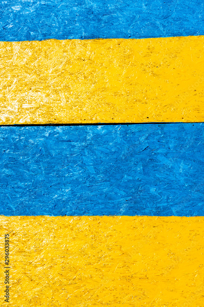 stripe of blue and yellow wood background texture with knots and holes. Old painted tree. Blue, yellow abstract background. stripe of blue and yellow wood background texture with knots and holes. Old painted tree. Blue, yellow abstract background.