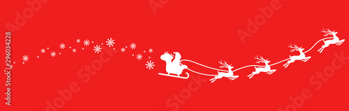 Santa Claus with sled and reindeers