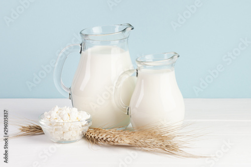 Wheat and jugs with fresh milk