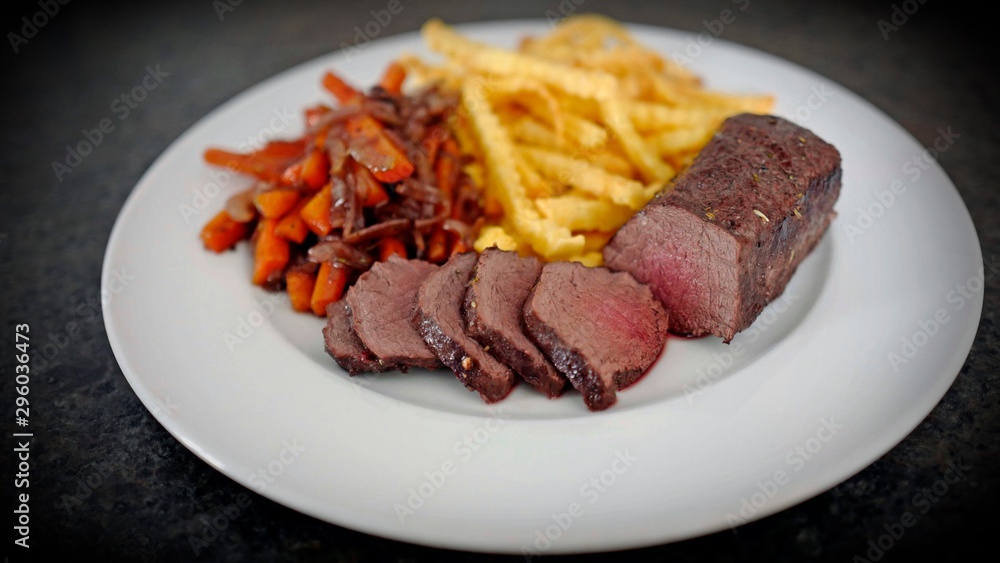delicious fillet from venison with vegetables and fries delicious fillet from venison with vegetables and fries