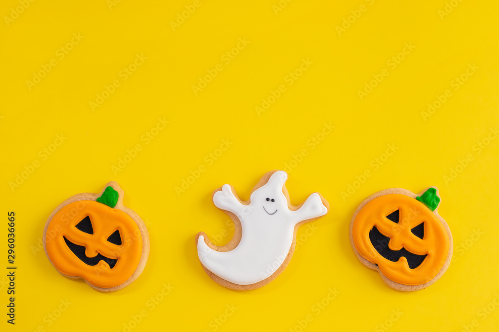 top view scary Halloween cookies on yellow background top view scary Halloween cookies on yellow background