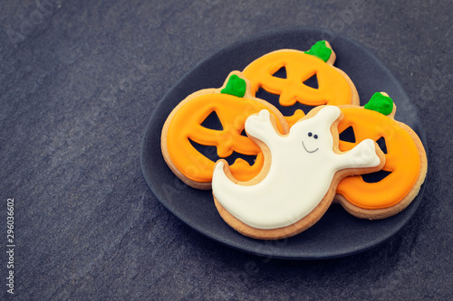 halloween cookies on dark ceramic background