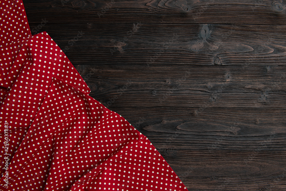 Red towel over wooden kitchen table. Red towel over wooden kitchen table.