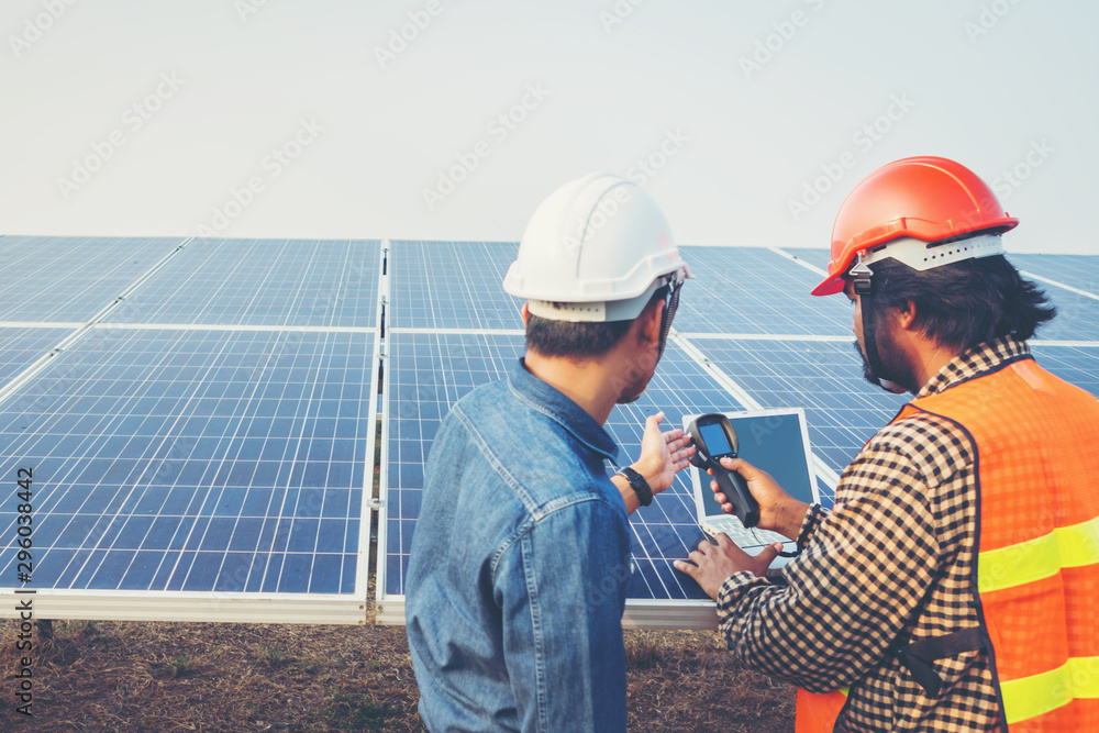 engineer working on checking equipment in solar power plant engineer working on checking equipment in solar power plant