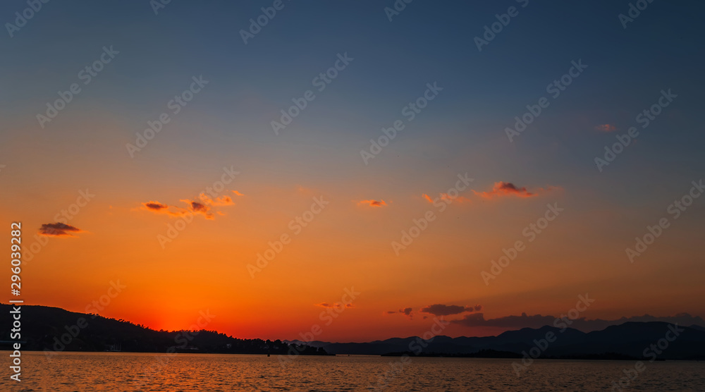 Natural Sunrise Sundown Over Sea Horizon island silhouette