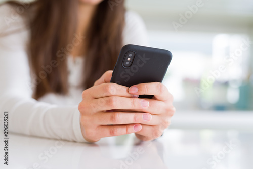 Close up of young woman using smartphone