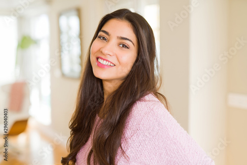 Beautiful brunette woman smiling cheerful  looking happy and positive