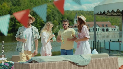 Wallpaper Mural Cheerful fashion young people dancing with drinks on summer party celebrating at hotel resort beach. Friendship. Vacation. Torontodigital.ca