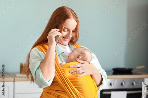 Young mother with little ba...