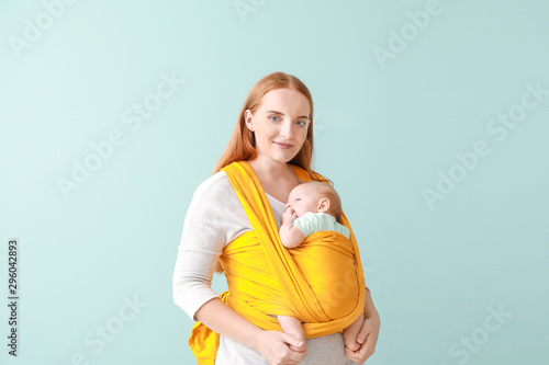 Mother with cute baby on co...