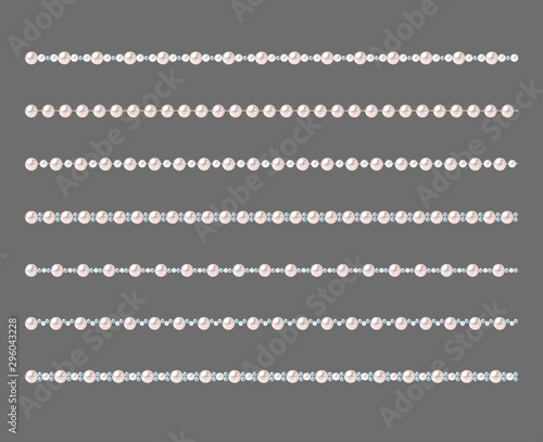 Set of pearl strings isolated on gray background.