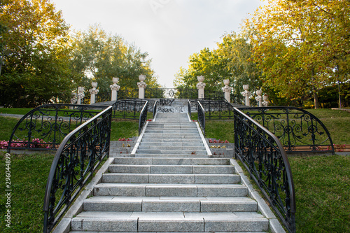 View of a long stairway in the middle of a park  on a beautiful autumn evening.
