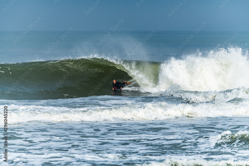 Bodyboarder surfing ocean wave