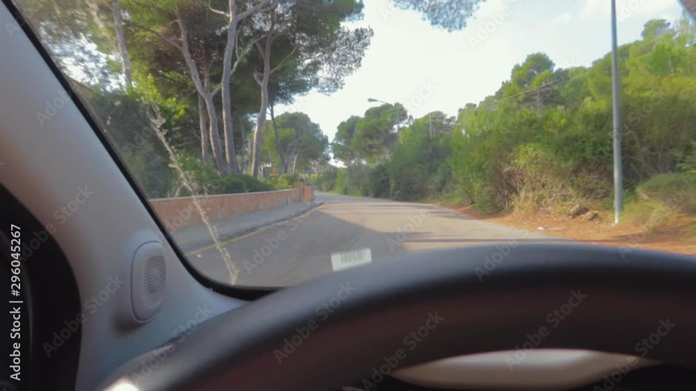 The best drives view from a car front seat in Majorca Spain, including the best routes for dramatic landscapes and interspersed with pretty sleepy villages, steering wheel and dash board in foreground The best drives view from a car front seat in Majorca Spain, including the best routes for dramatic landscapes and interspersed with pretty sleepy villages, steering wheel and dash board in foreground