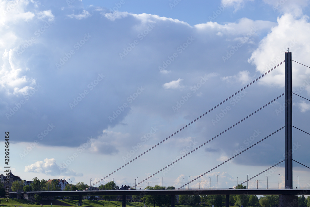 Suspension bridge crossing the river rhine in dusseldorf, germany