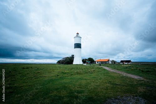 lighthouse at Ottenby in sweden with cloudy sky photo