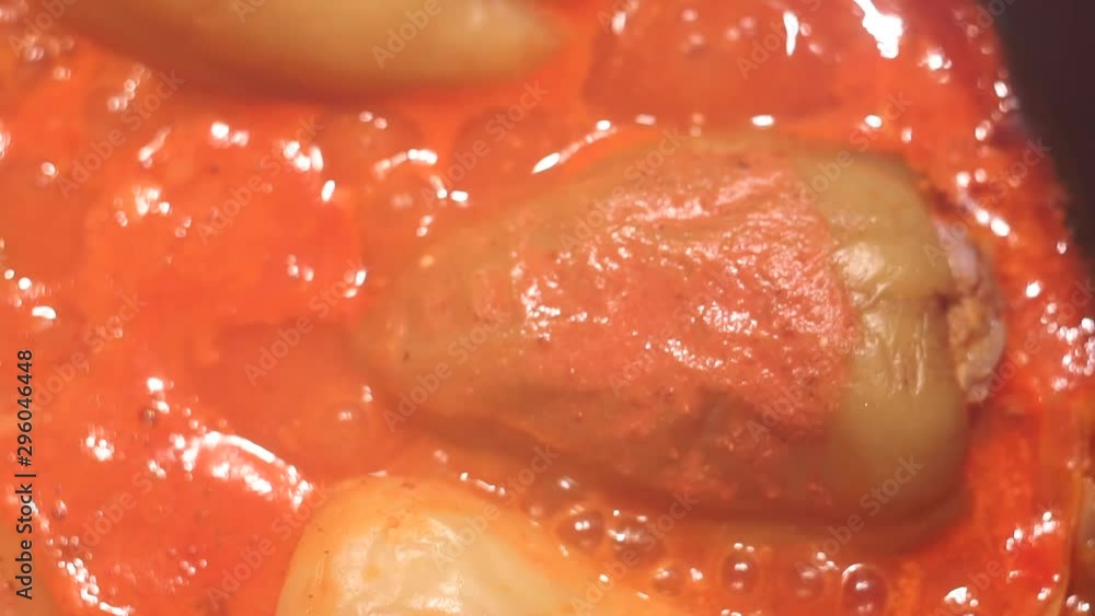 stuffed peppers closeup with minced meat in tomato sauce. Food preparation stuffed peppers closeup with minced meat in tomato sauce. Food preparation