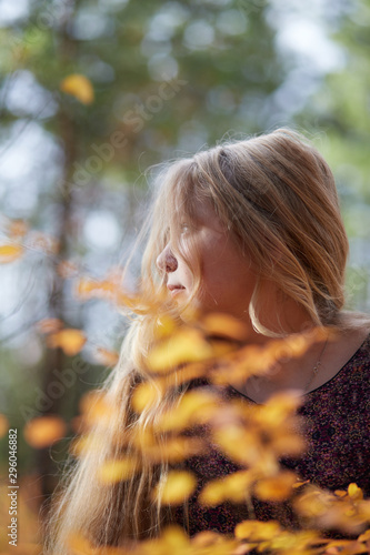 Beautiful girl with white hair in the autumn forest