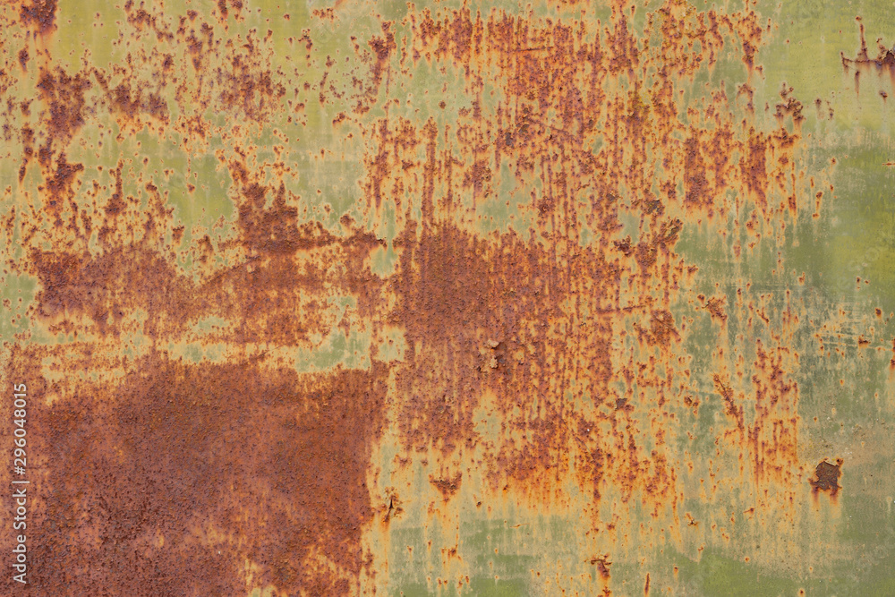 Rusty metal wall, old sheet of iron covered with rust and corrosion paint. Oxidized iron panel. Texture or background. Rusty metal wall, old sheet of iron covered with rust and corrosion paint. Oxidized iron panel. Texture or background.