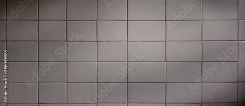 Backgrounds and textures. Old and grunge floor tile background in white colors with ambient light