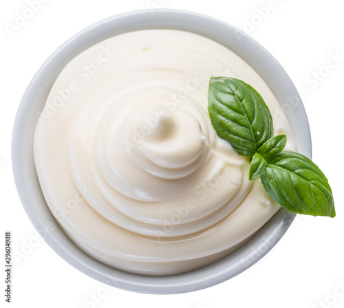 Mayonnaise swirl in white bowl. Top view. Clipping path.