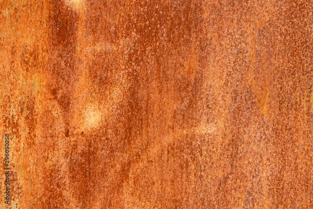 Rusty yellow-red textured metal surface. The texture of the metal sheet is prone to oxidation and corrosion. Textured background in grunge Style Rusty yellow-red textured metal surface. The texture of the metal sheet is prone to oxidation and corrosion. Textured background in grunge Style