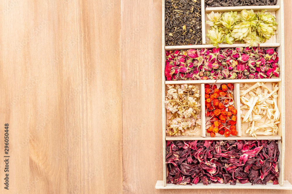 Assorted tea leaves, dried berries and flowers. Healthy drink concept. Assorted tea leaves, dried berries and flowers. Healthy drink concept.