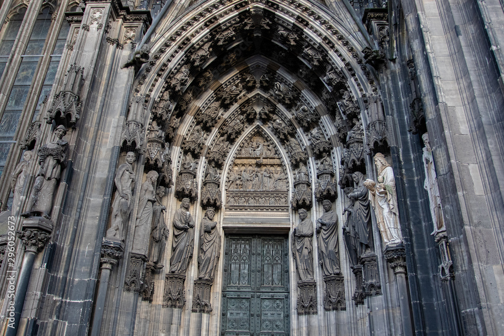 Sculptures of saints on the portal of Cologne Cathedral on the Domkloster street  in Bonn in Germany