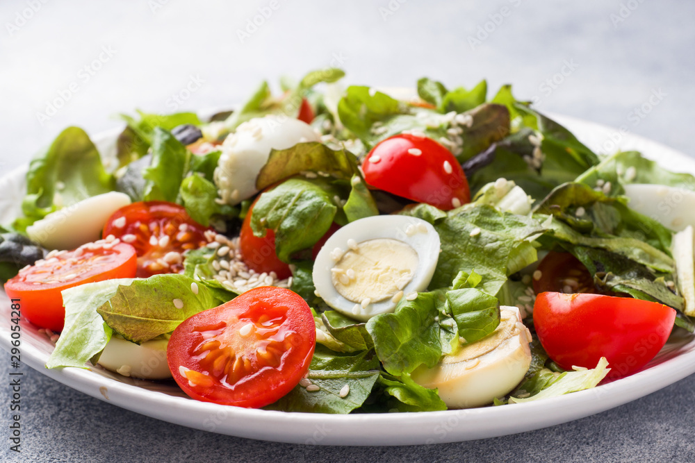 Fresh salad with tomatoes and quail eggs and lettuce. Fresh salad with tomatoes and quail eggs and lettuce.