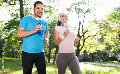 Happy couple running and exercising together outdoor