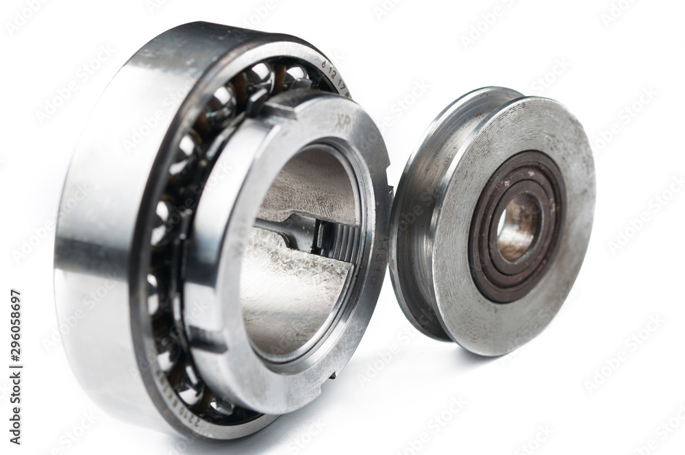 Ball bearing and pulley isolated on white background.Copy space Ball bearing and pulley isolated on white background.Copy space