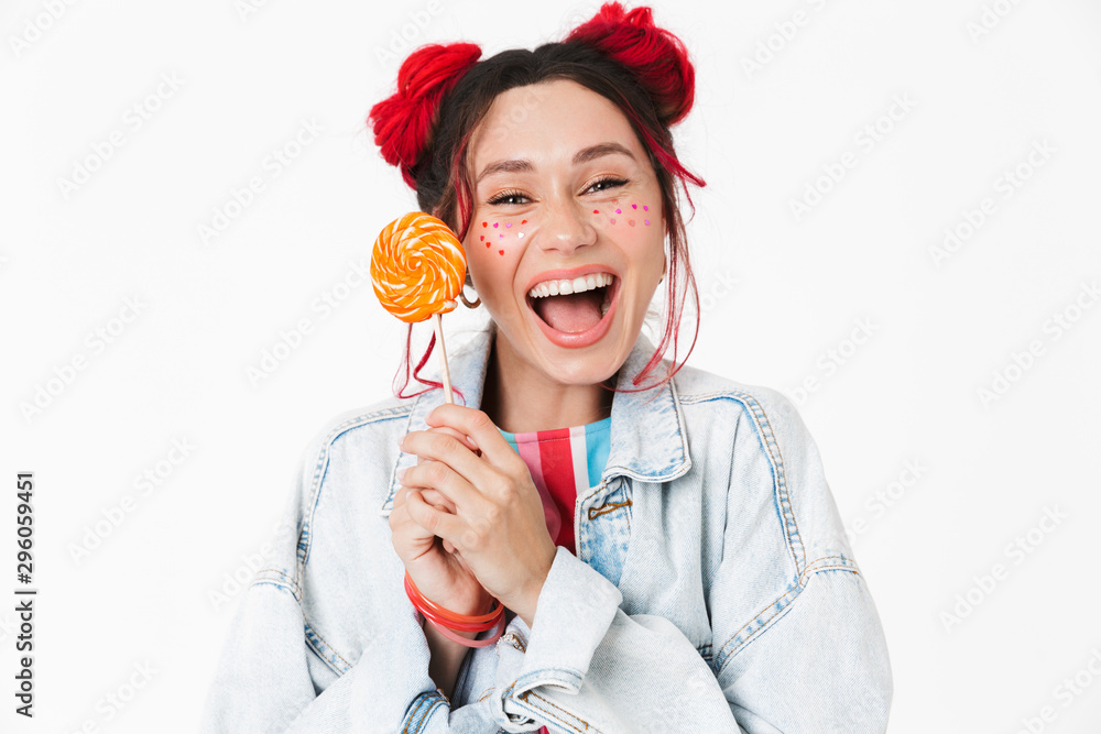 Image of laughing cute woman holding lollipop and looking at camera Image of laughing cute woman holding lollipop and looking at camera