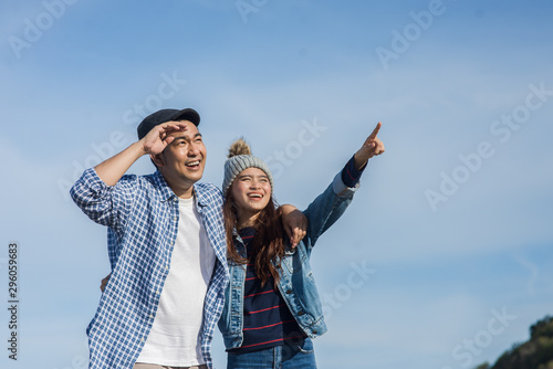 Asian couple enjoying nature view outdoor, lifestyle concept.