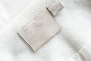 laundry care clothing label on fabric texture