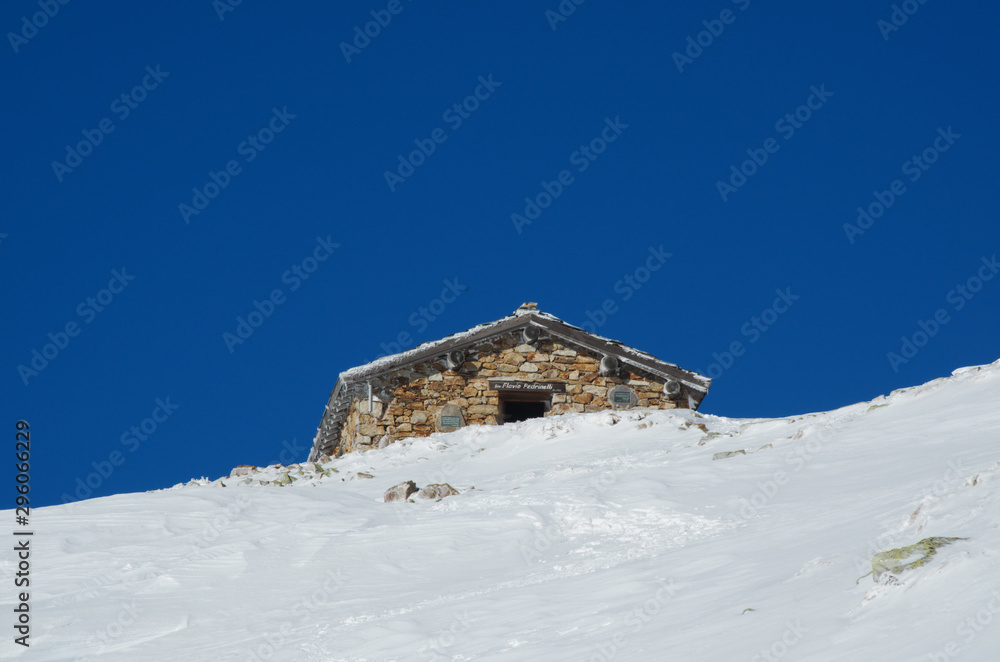 Mountain hut in a snowy slope Mountain hut in a snowy slope
