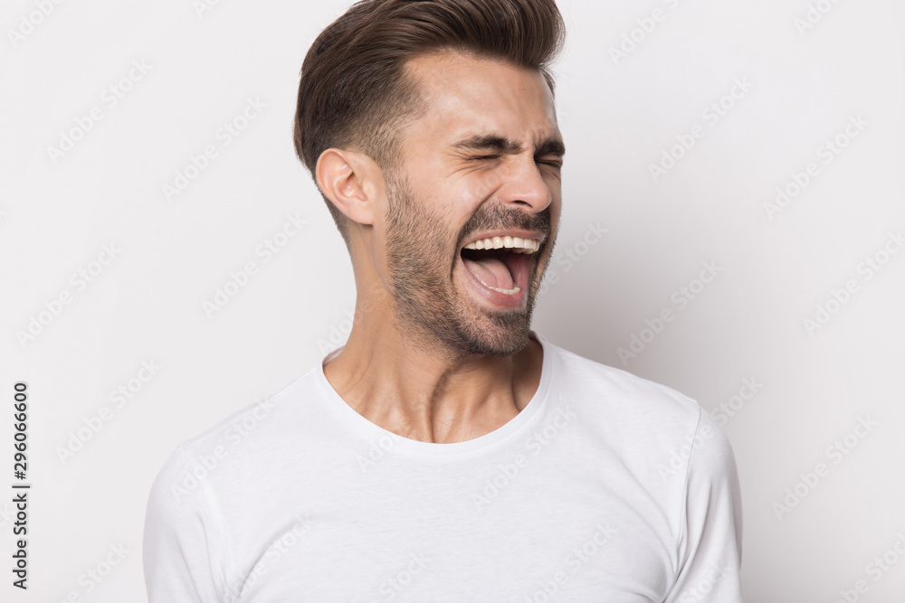 Furious caucasian man feel displeased yelling loudly Furious caucasian man feel displeased yelling loudly