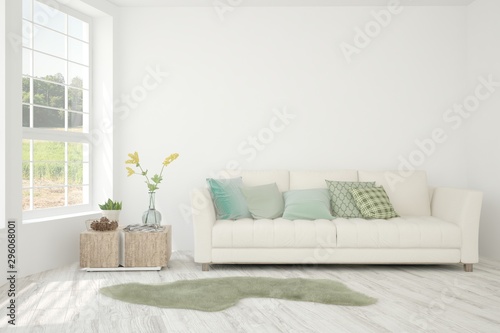 Stylish room in white color with sofa and summer landscape in window. Scandinavian interior design. 3D illustration