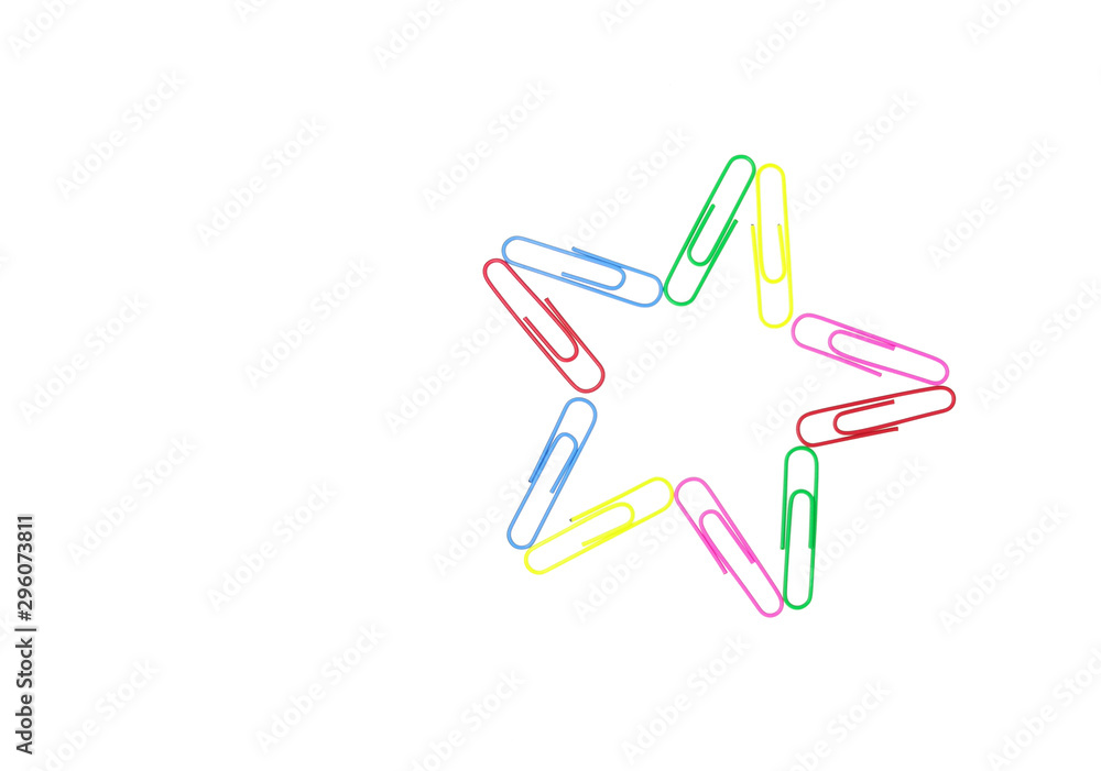 Series of colorful paper clips with star shape on white background. Decorative paper clips in pink, yellow, green, red and blue colors