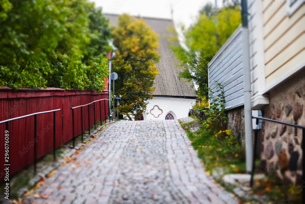 Street of Old Porvoo, Finland. Beautiful city autumn landscape with Porvoo Cathedral and colorful wooden buildings.