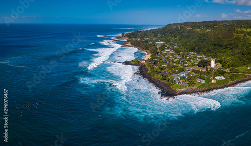 Aerial panorama of the North Shore of Oahu with the group of surfers waiting the waves at Waimea Bay surf spot. Hawaii