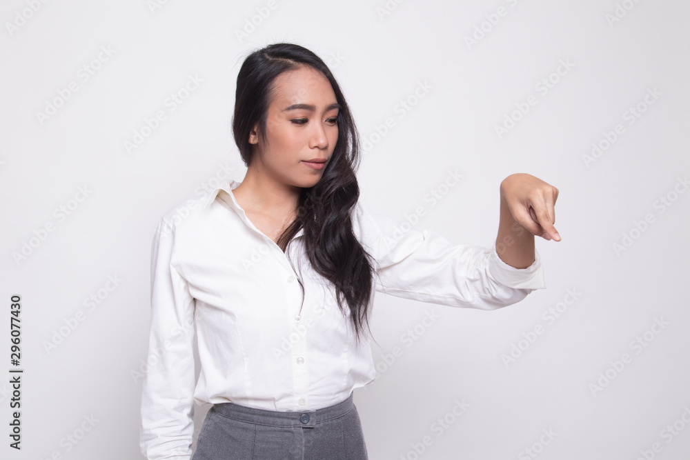 Beautiful young Asian woman point down to blank space. Beautiful young Asian woman point down to blank space.