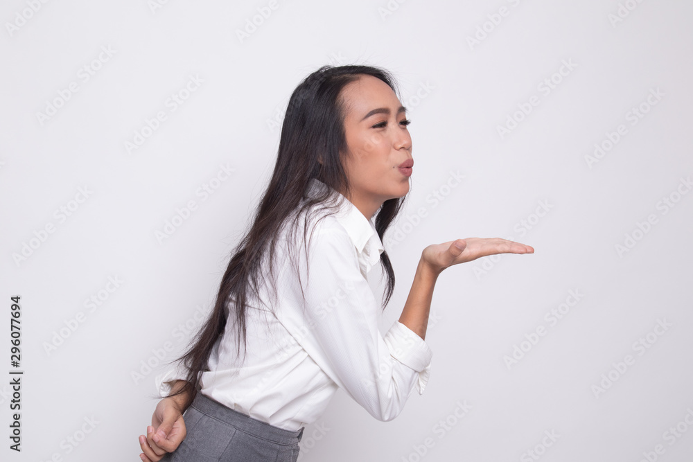 Beautiful young Asian woman blow a kiss. Beautiful young Asian woman blow a kiss.