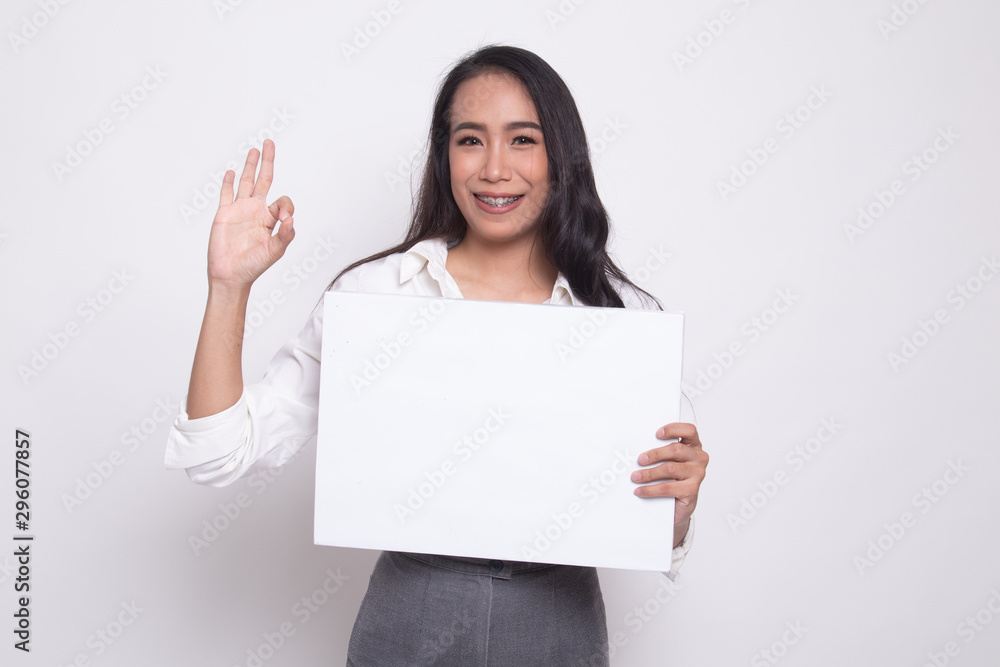 Young Asian woman show OK with white blank sign. Young Asian woman show OK with white blank sign.