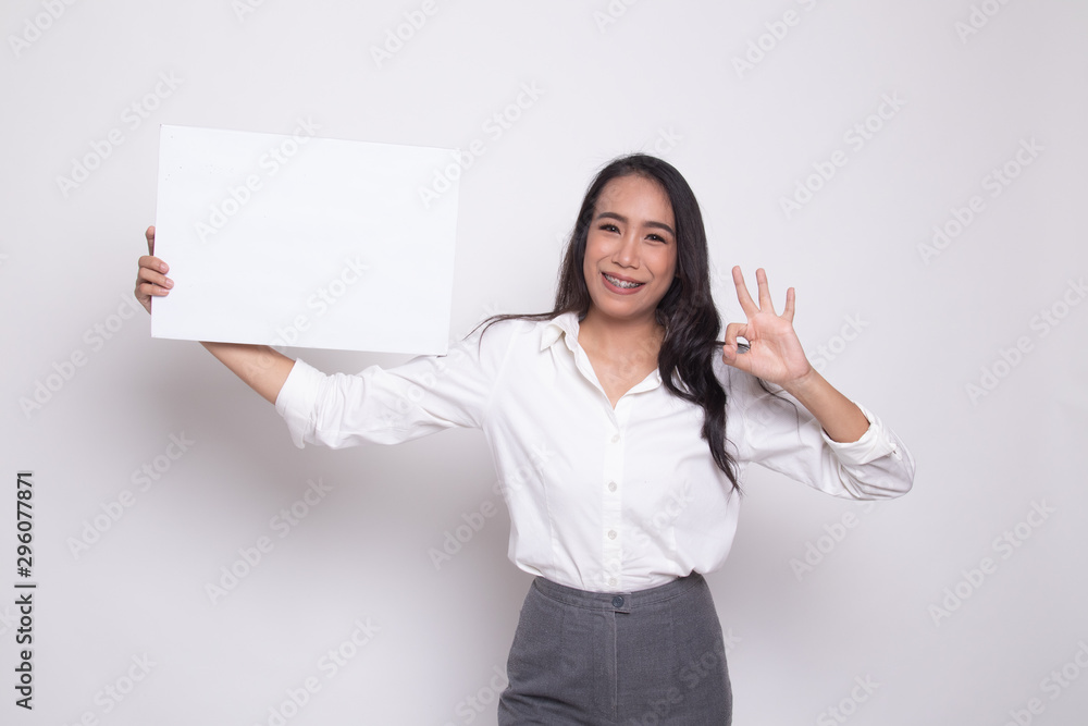 Young Asian woman show OK with white blank sign. Young Asian woman show OK with white blank sign.