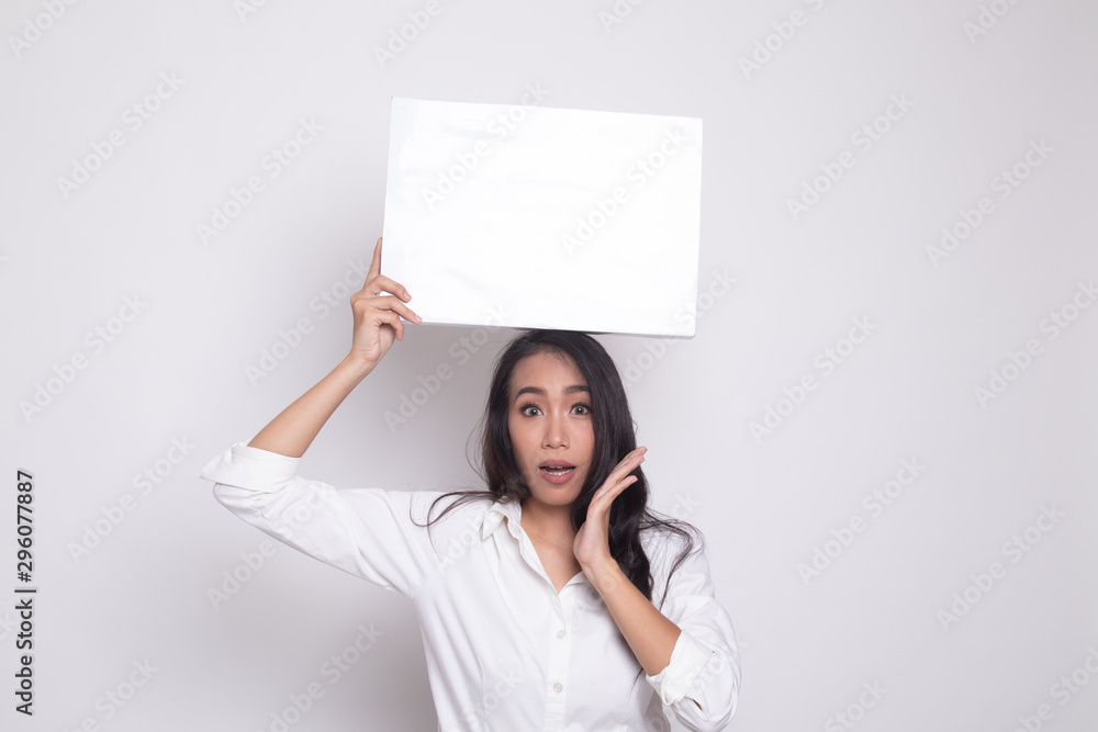 Young Asian woman surprise with white blank sign. Young Asian woman surprise with white blank sign.
