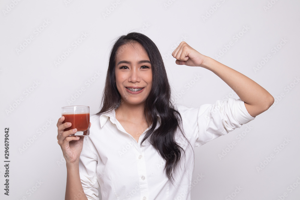 Strong healthy Asian woman with tomato juice. Strong healthy Asian woman with tomato juice.
